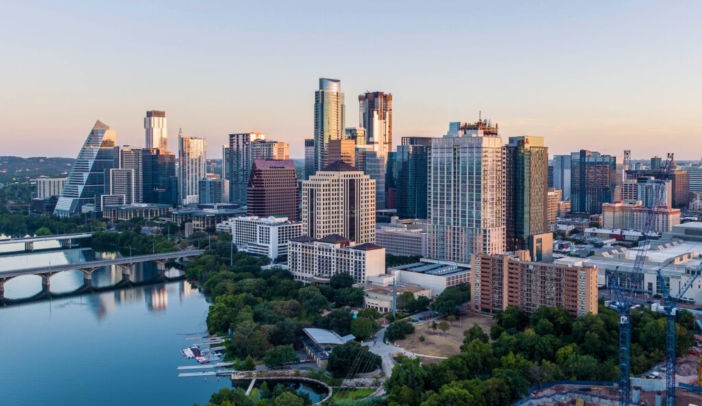 Home 6 Austin city skyline next to Lady Bird Lake.