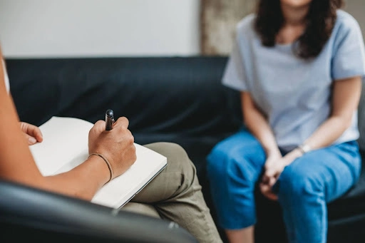 Woman sitting in individual therapy session room in Austin for consultation