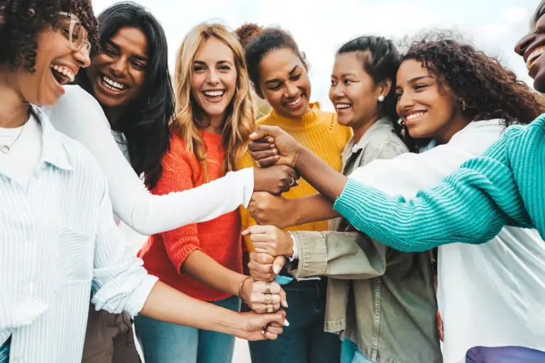 Group Therapy 6 Teen therapy group embracing one another with smiles and laughter.