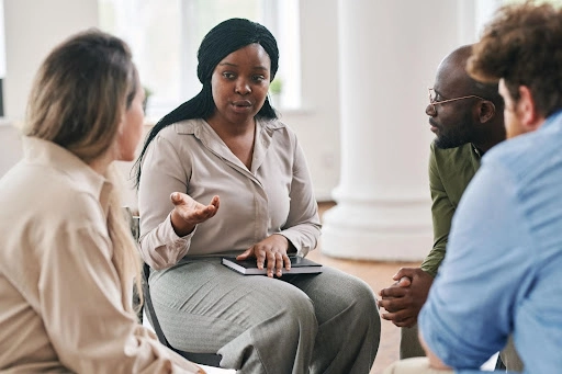 Circle of adults in group therapy sessions for intensive outpatient programs in Austin.