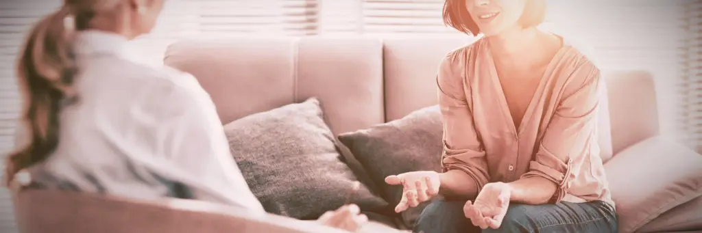 A woman speaking to her therapist during her partial hospitalization.
